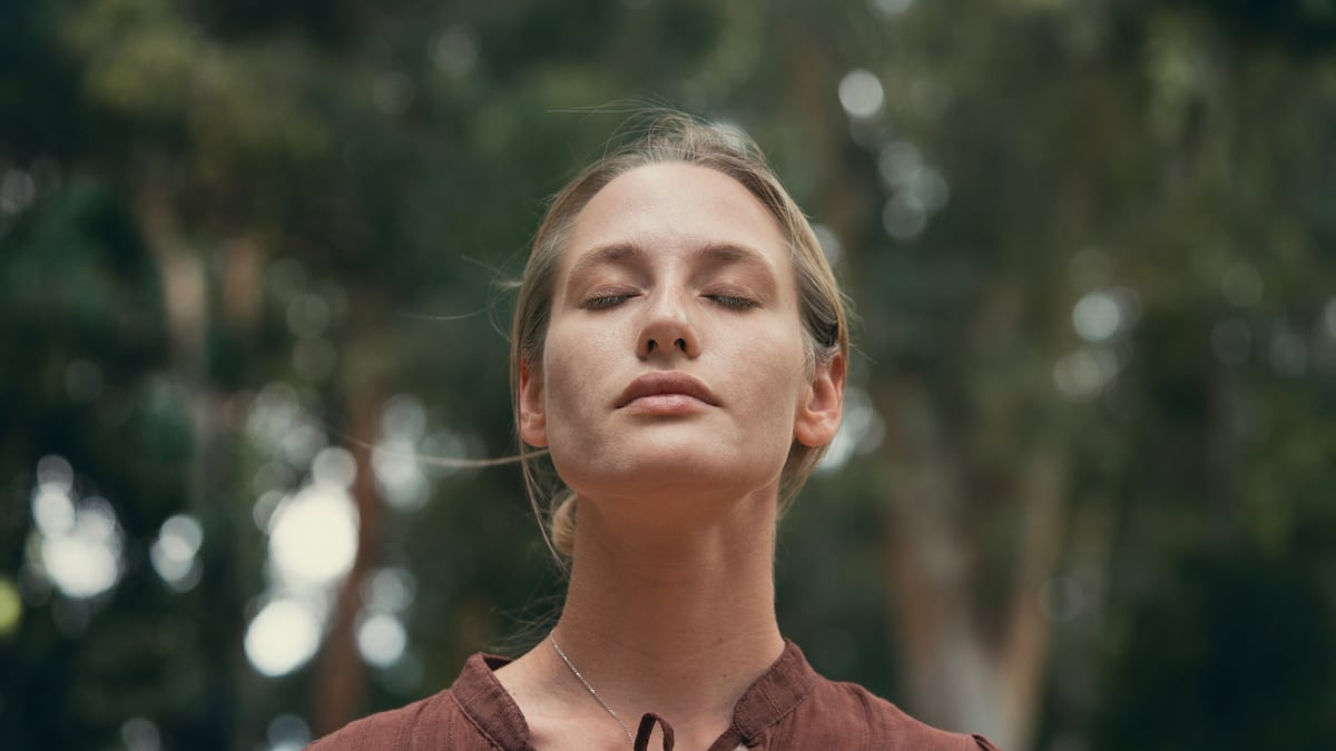 Woman breathing fresh air outdoors